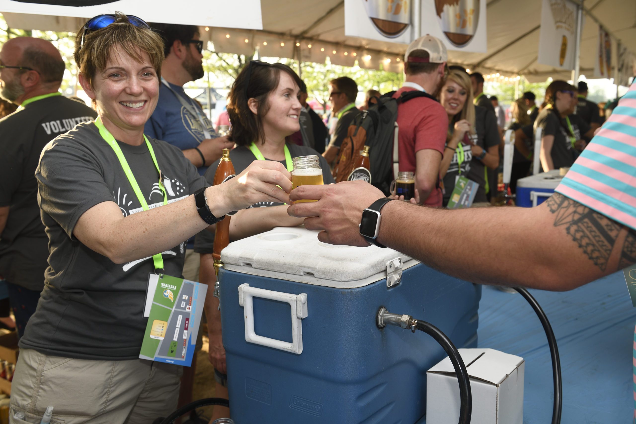 Woman takes a glass of beer to enjoy at the Chow Wagon