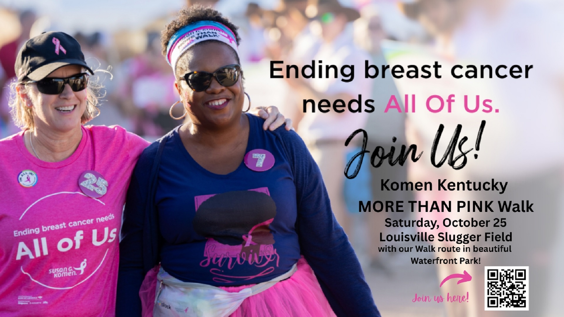Two women smiling with breast cancer awareness shirts on.