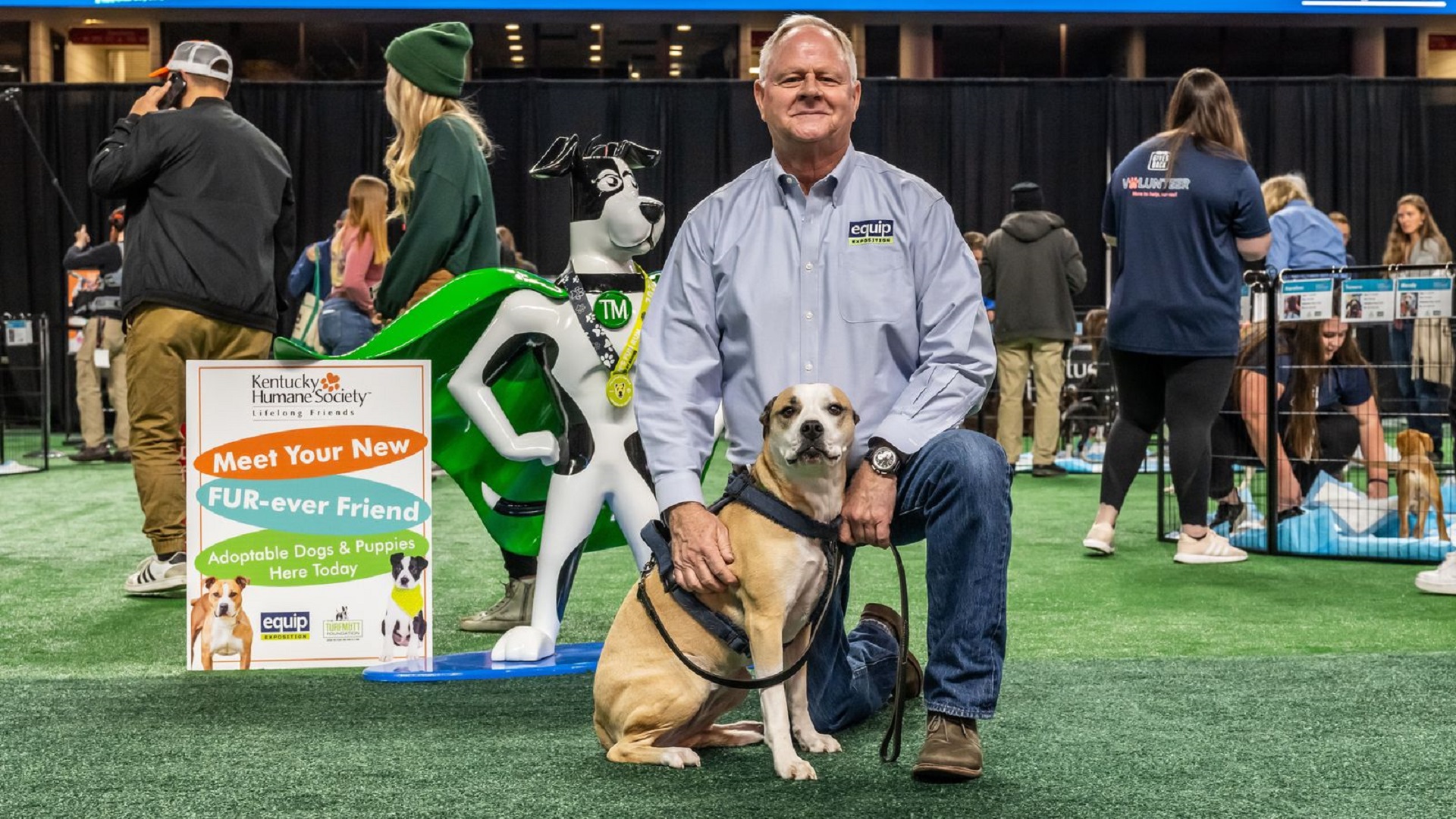 Dog owner with his dog pose proudly at the event.