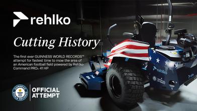 “Rehlko promotional graphic showing a custom vehicle wrapped in an American flag design, with the headline ‘Cutting History’ and text announcing a Guinness World Records official attempt.”
